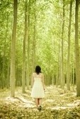 4747589-young-woman-walking-through-the-woods