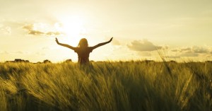 26054-field-girl-woman-armsout-praise.1200w.tn