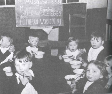 Picture of German Children receiving aid from LWR in 1951, taken from Together in Hope book by John Bachman.